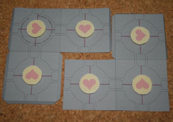 Stick the circles on to the flat parts of the box.